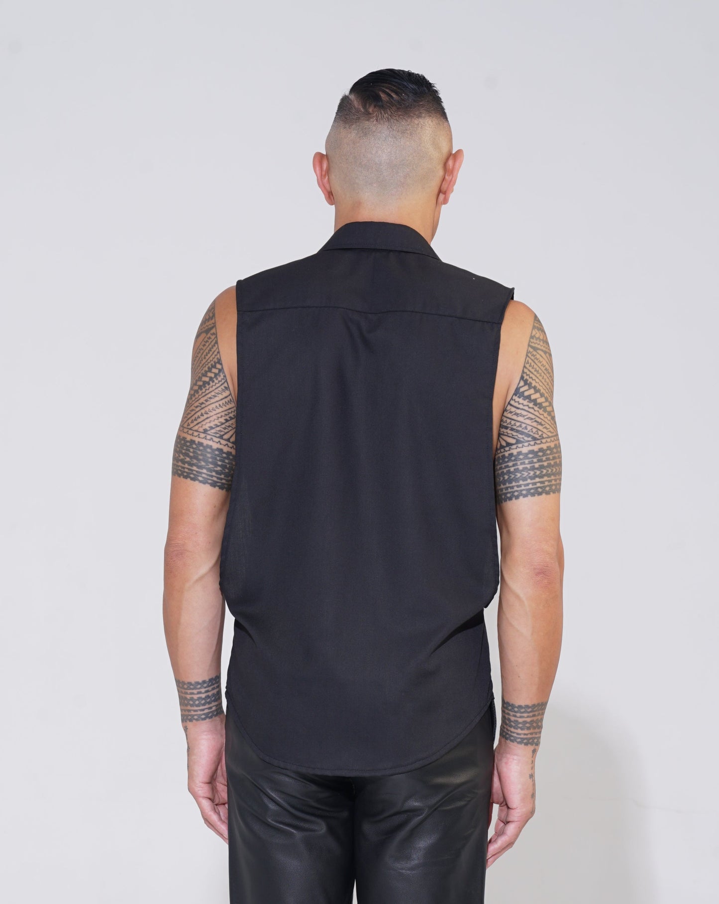 Endemann black sleeveless shirt with lowered armhole with leather pant