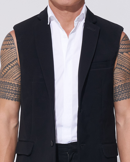 Black tailored sleeveless jacket with two-button front over an endemann white sleeveless shirt on male model