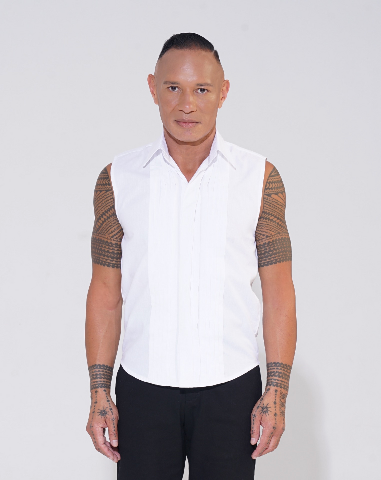 white pleat front sleeveless shirt